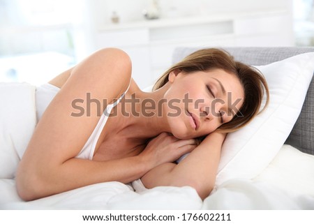 Closeup of woman asleep in bed