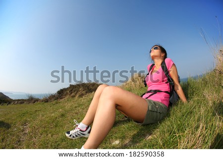Girl taking some sun on a hiking journey