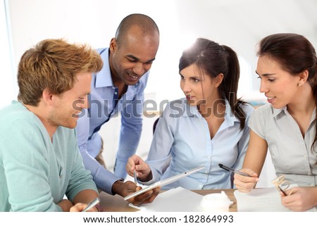 Young business people meeting around table