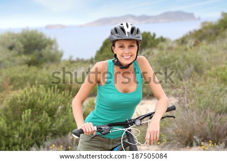 Portrait of smiling girl riding sports bike