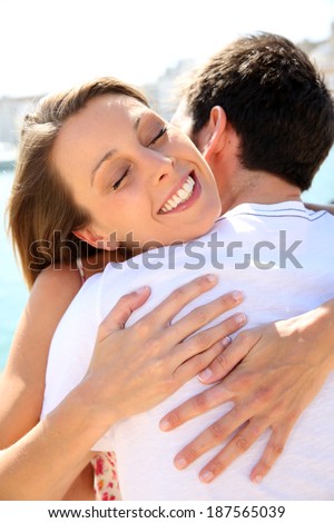 Couple hugging and being happy to get together