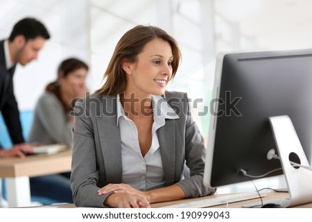 Businesswoman working on desktop computer