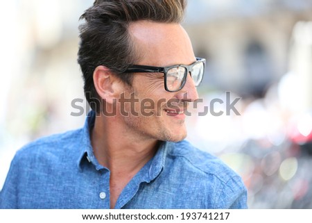 Portrait of handsome 40 year old man with eyeglasses