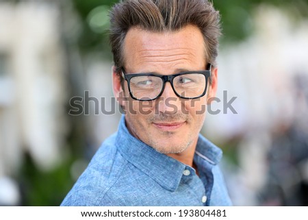 Portrait of handsome 40 year old man with eyeglasses