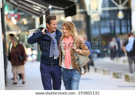 Middle-aged couple doing shopping on week-end