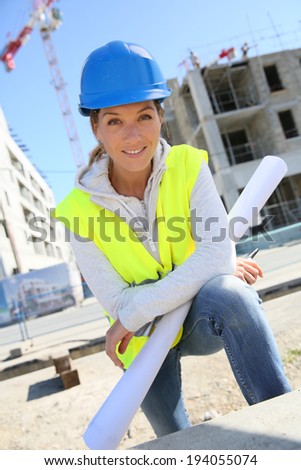Portrait of woman engineer working on building site