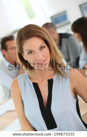 Portrait of beautiful woman attending business meeting