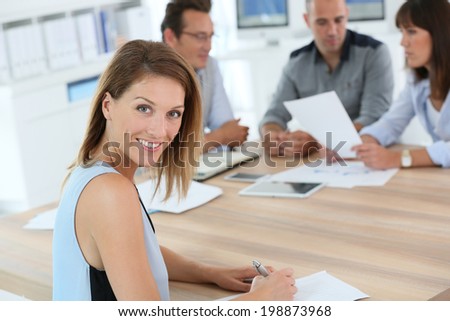 Portrait of beautiful woman attending business meeting