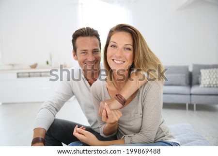 Lovely 40-year-old couple at home