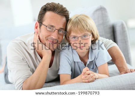 Portrait of daddy and son wearing eyeglasses