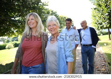 Family walk in park on sunday morning
