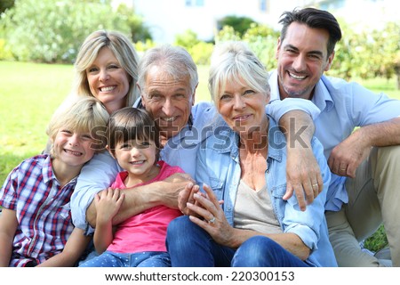 Happy 3 generation family in grandparents\' backyard
