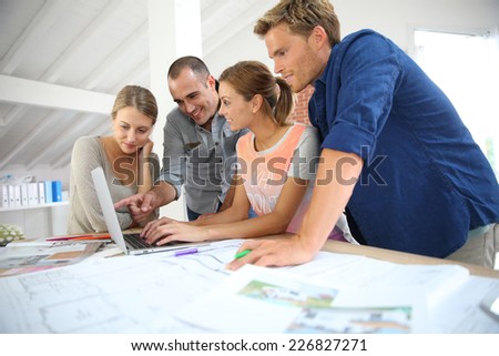 Group of young people studying architecture