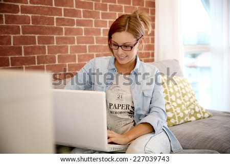 Young woman using laptop computer at home