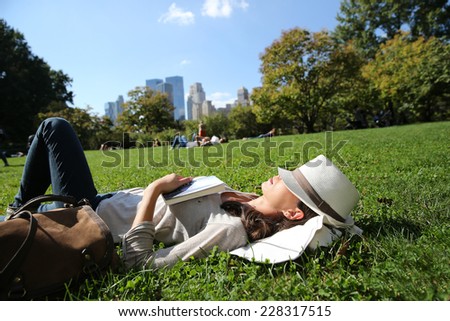 Profile view of woman relaxing in Central Park, NYC
