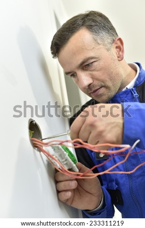 Electrician working on building site
