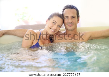 Romantic couple relaxing in hot tub