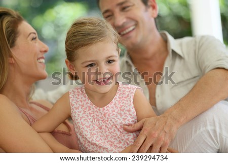 Portrait of happy family laughing together