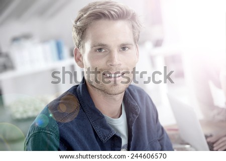 Portrait of smiling 25-year-old guy