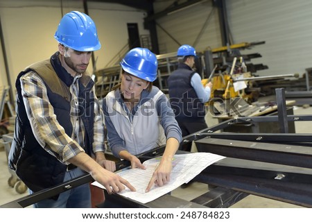 Industrial people meeting together in factory