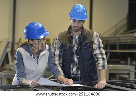 Industrial people meeting together in factory