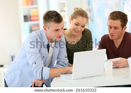 Young people at university using new technology items