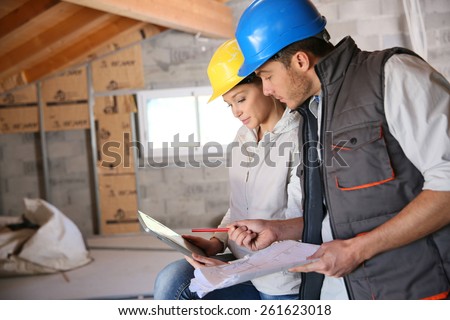Young woman in professional training on building site