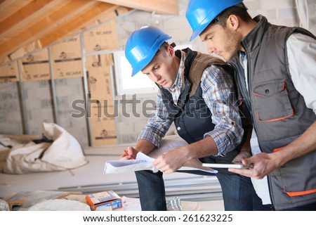 Construction engineers meeting on site