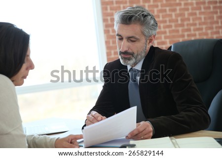 Attorney meeting client in office