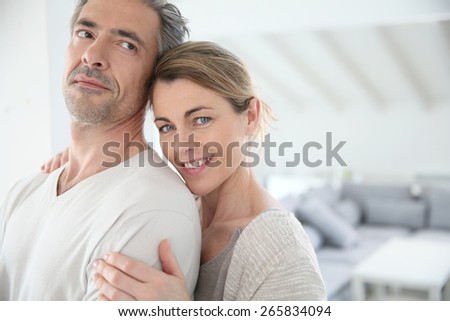 Happy mature couple in brand new home
