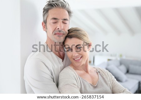 Portrait of mature couple relaxing at home