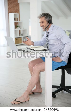 Businessman on video meeting from home in relaxed outfit