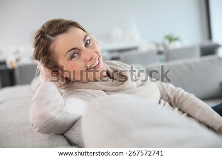45-year-old woman relaxing in sofa