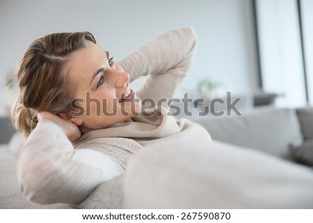 45-year-old woman relaxing in sofa
