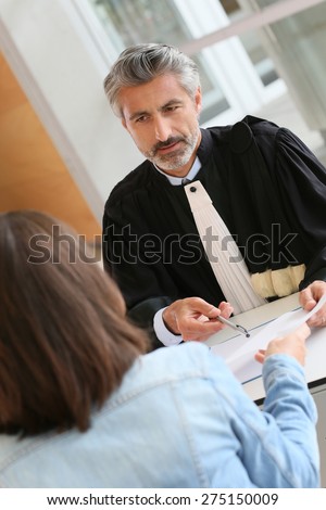 Lawyer meeting client in courthouse office