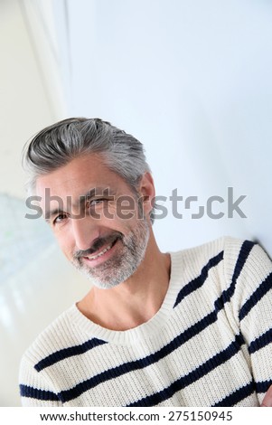 Portrait of handsome mature man on white background