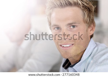 Portrait of smiling handsome man at work