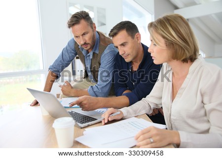 Financial department people working on budget plan