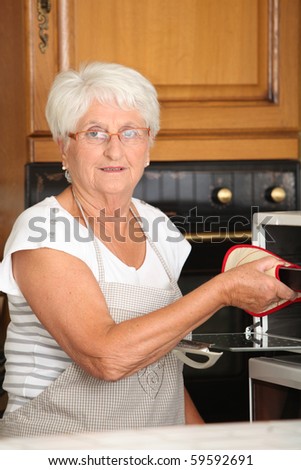 Elderly woman in home kitchen