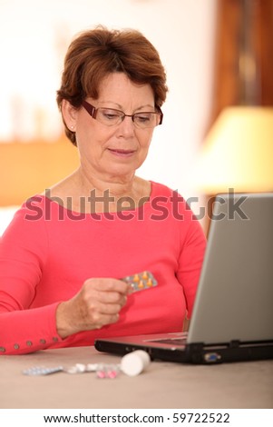 Senior woman looking for medical information on internet