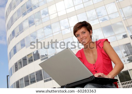 Student at college campus with laptop computer
