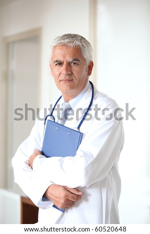 Portrait of doctor standing in hall