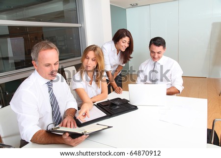 Business people meeting around table