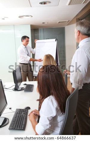 Group of people attending business presentation