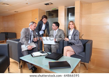 Group of associates meeting in lounge