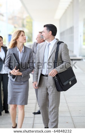 Business people walking outside a congress center