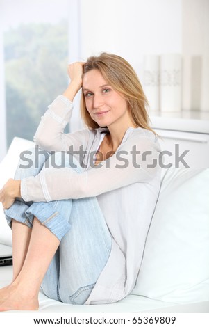 Closeup of beautiful blond woman relaxing at home