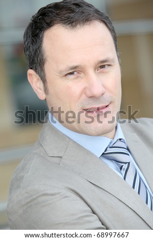 Businessman standing outside the office