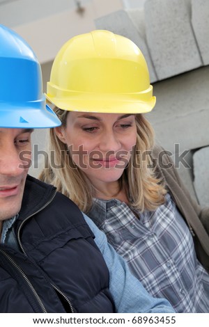 Closeup of architects with security helmets
