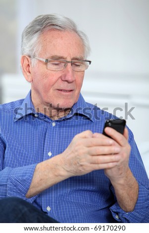 Elderly man talking on mobile phone